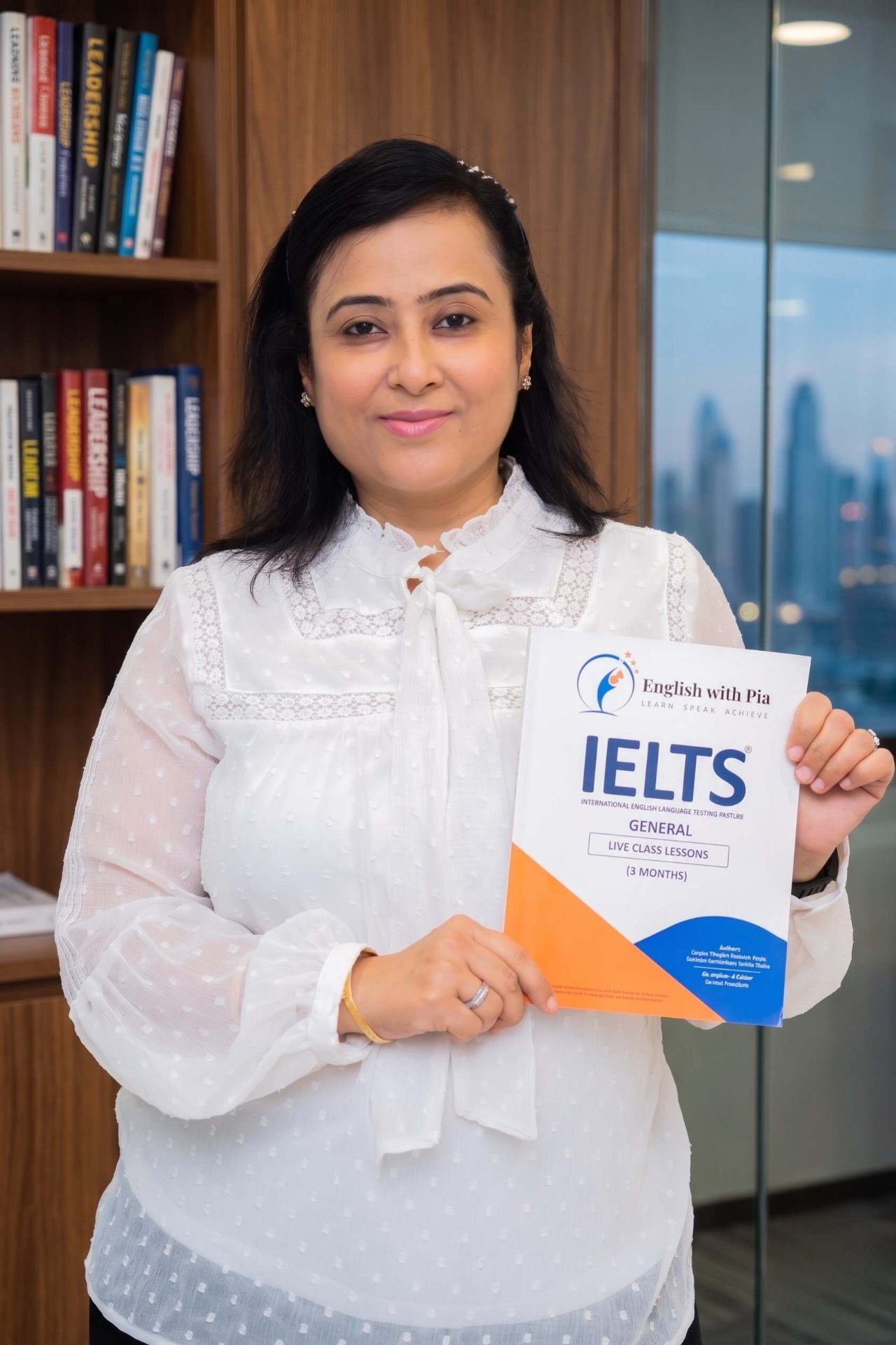Pia Bhagchandani holding the IELTS workbook